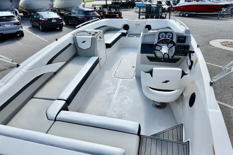 Slide: The Image of 2026 Starcraft SVX 211 OB boat interior with modern seating and control panel. - 5