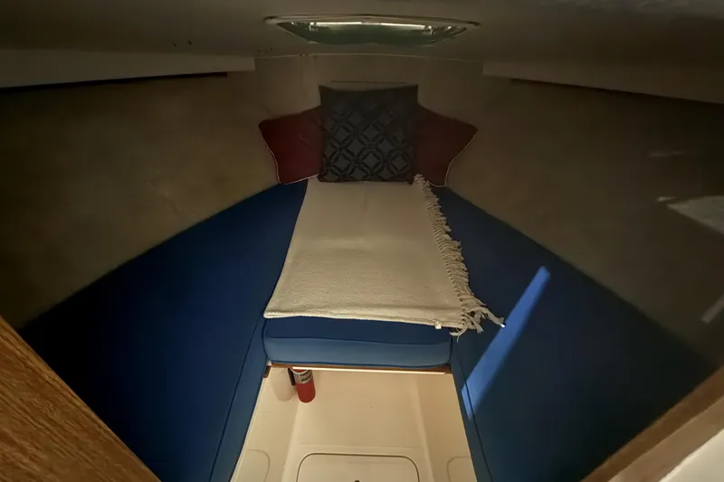 Slide: The Image of Cozy cabin interior of a 1973 Bertram 28 Flybridge Cruiser with cushions and pillows. - 14