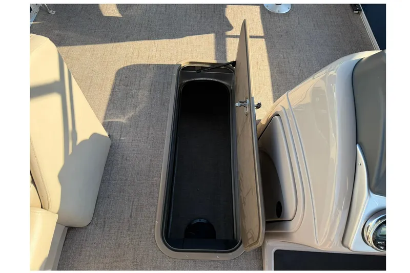 Slide: The Image of Open storage compartment on 2021 Ranger Reata 223F boat deck. - 14