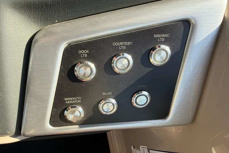 Slide: The Image of Control panel of a 2021 Ranger Reata 223F boat with labeled buttons. - 19