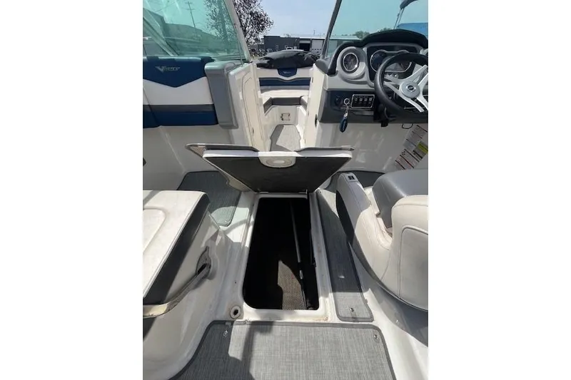 Slide: The Image of 2016 Chaparral Vortex 203 VR boat interior with open storage compartment. - 10