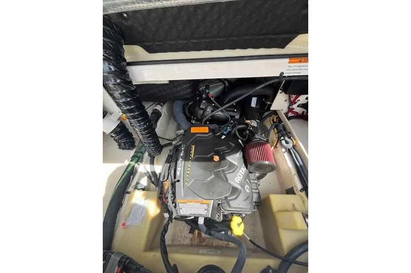 Slide: The Image of Engine compartment of 2016 Chaparral Vortex 203 VR boat, featuring Rotax engine. - 13