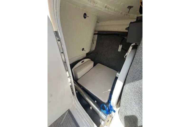 Slide: The Image of Interior storage compartment of 2016 Chaparral Vortex 203 VR boat. - 14
