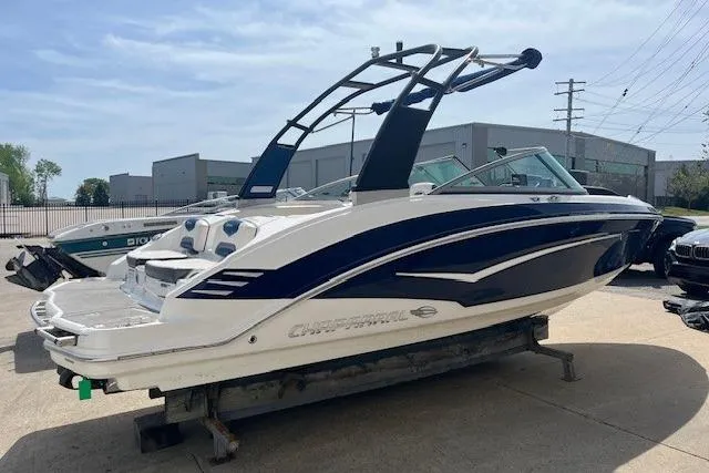 Slide: The Image of 2016 Chaparral Vortex 203 VR boat on display in a marina setting. - 2