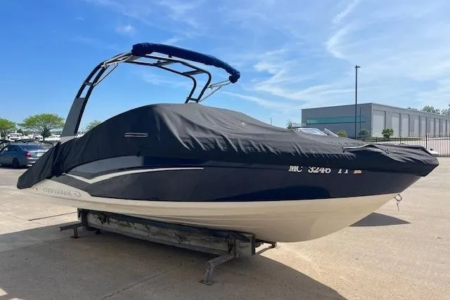 Slide: The Image of 2016 Chaparral Vortex 203 VR boat covered, parked outdoors on a sunny day. - 3