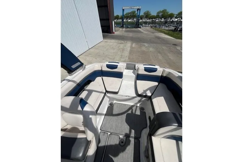 Slide: The Image of 2016 Chaparral Vortex 203 VR boat interior with seating and dock view. - 5