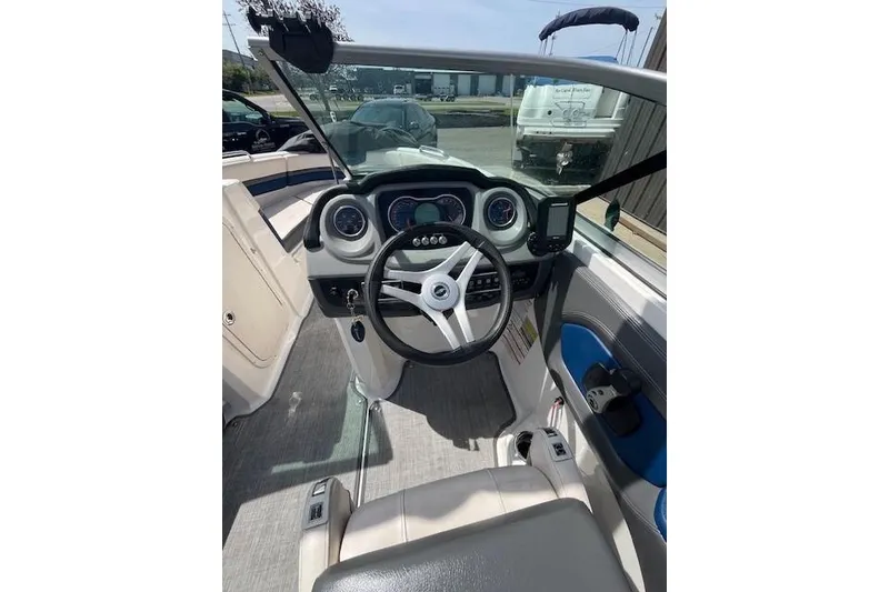 Slide: The Image of 2016 Chaparral Vortex 203 VR boat cockpit with steering wheel and dashboard controls. - 7