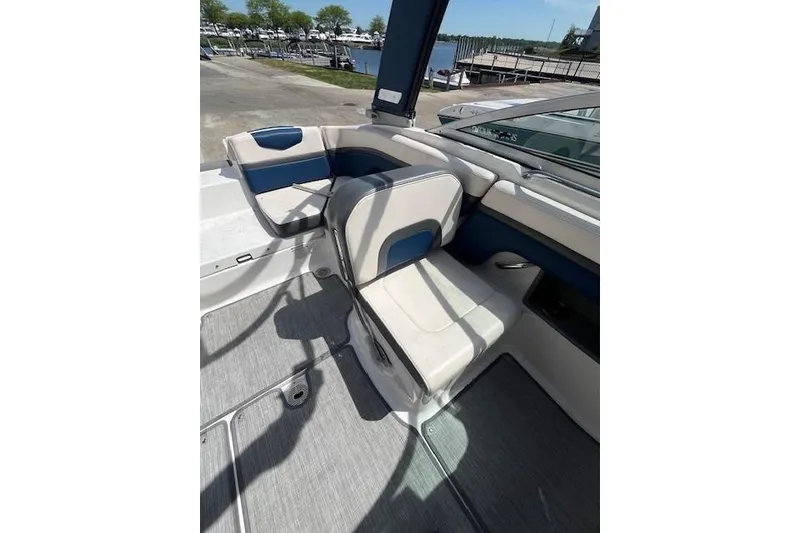 Slide: The Image of 2016 Chaparral Vortex 203 VR boat interior with blue and white seating. - 8