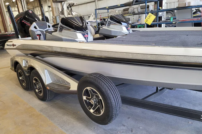 The Image of 2023 Ranger Z521R boat on trailer in a workshop setting. - 0