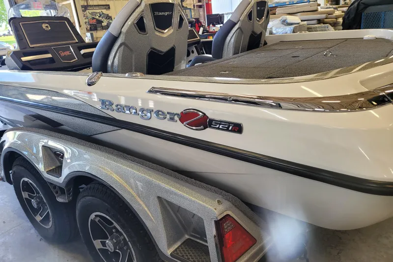 Slide: The Image of 2023 Ranger Z521R boat interior, showcasing sleek design and comfortable seating. - 1