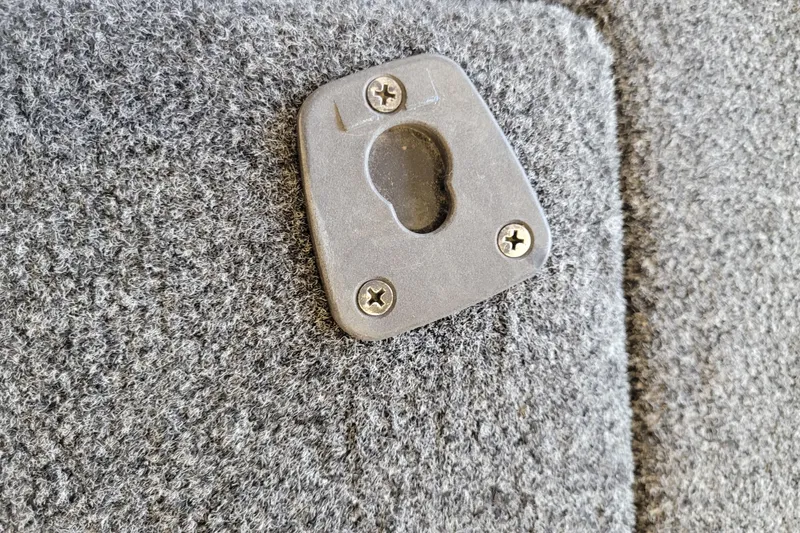 Slide: The Image of Close-up of a 2023 Ranger Z521R carpeted surface with a mounted bracket. - 10
