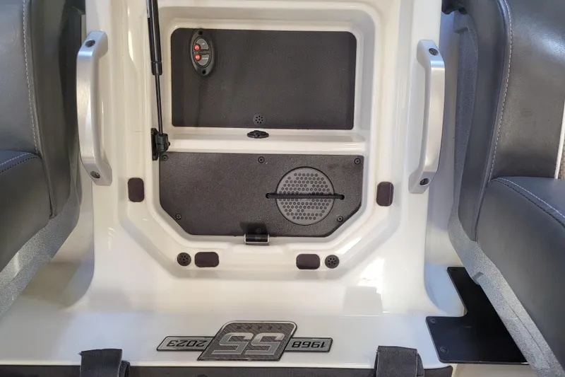 Slide: The Image of Interior of 2023 Ranger Z521R boat, featuring seating and control panel details. - 13