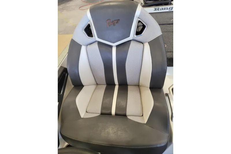 Slide: The Image of 2023 Ranger Z521R boat seat with gray and white upholstery. - 15