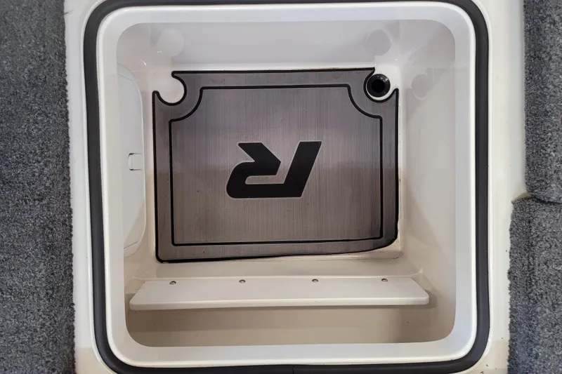 Slide: The Image of 2023 Ranger Z521R storage compartment with logo, featuring a sleek interior design. - 21