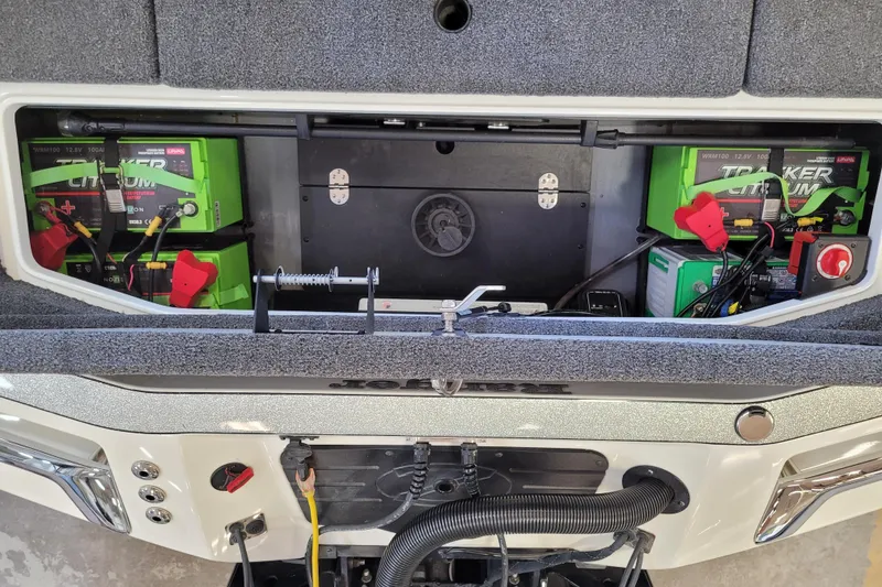 Slide: The Image of 2023 Ranger Z521R boat battery compartment with Tracker lithium batteries and wiring setup. - 23