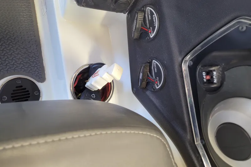 Slide: The Image of Control panel of a 2023 Ranger Z521R boat with switches and gauges. - 28