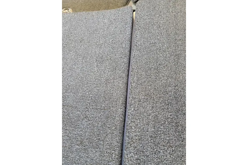 Slide: The Image of Gray carpeted surface of 2023 Ranger Z521R boat interior. - 32