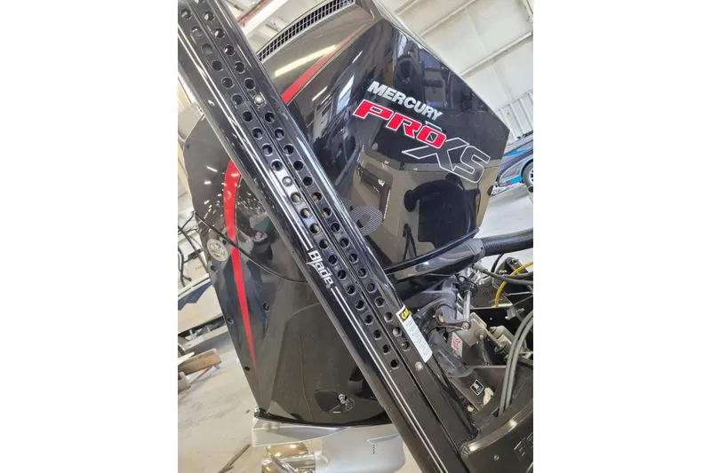 Slide: The Image of 2023 Ranger Z521R with Mercury Pro XS engine in a workshop setting. - 4