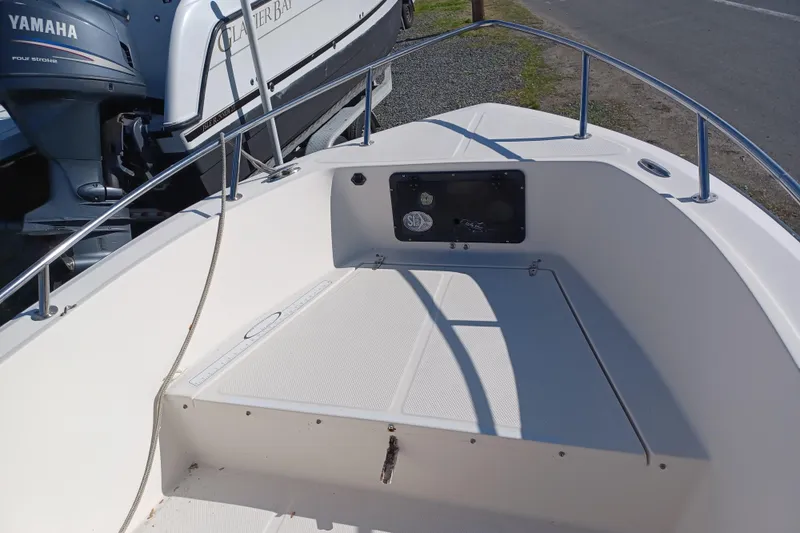 Slide: The Image of 2005 Key West 1900 Center Console boat with Yamaha engine, docked outdoors. - 10