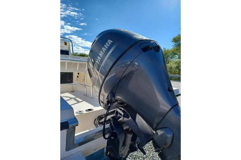 Slide: The Image of 2005 Key West 1900 Center Console boat with Yamaha outboard motor under clear blue sky. - 3