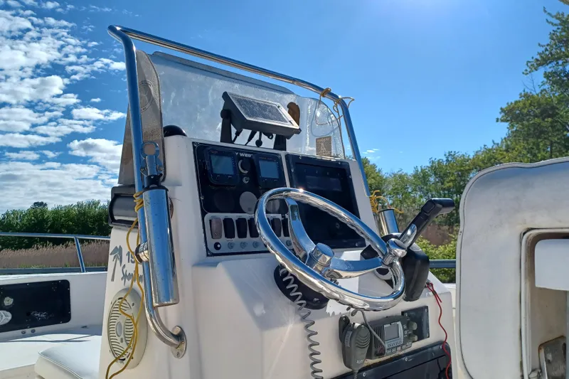 Slide: The Image of Center console of a 2005 Key West 1900 boat under clear blue sky. - 6