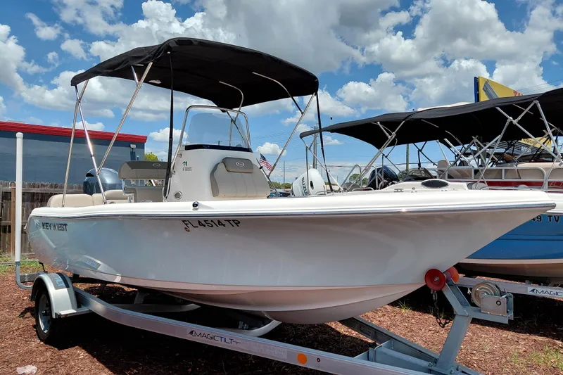 The Image of 2023 Key West 189 FS boat on trailer under blue sky. - 1