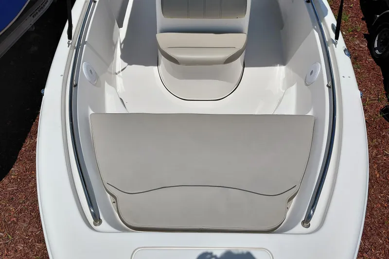 Slide: The Image of 2023 Key West 189 FS boat interior with cushioned seating and sleek design. - 10