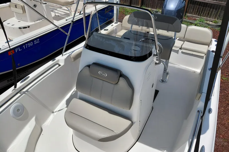Slide: The Image of 2023 Key West 189 FS boat interior with seating and steering console. - 13