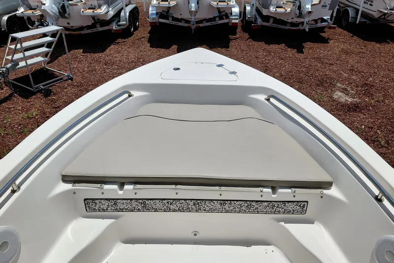 Slide: The Image of 2023 Key West 189 FS boat interior with cushioned seating and stainless steel rails. - 14