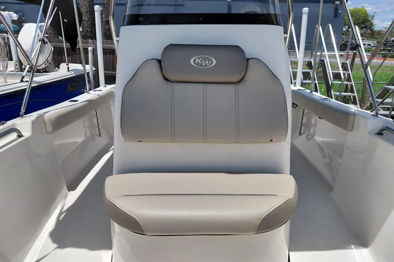 Slide: The Image of 2023 Key West 189 FS boat interior with cushioned seating and sleek design. - 17