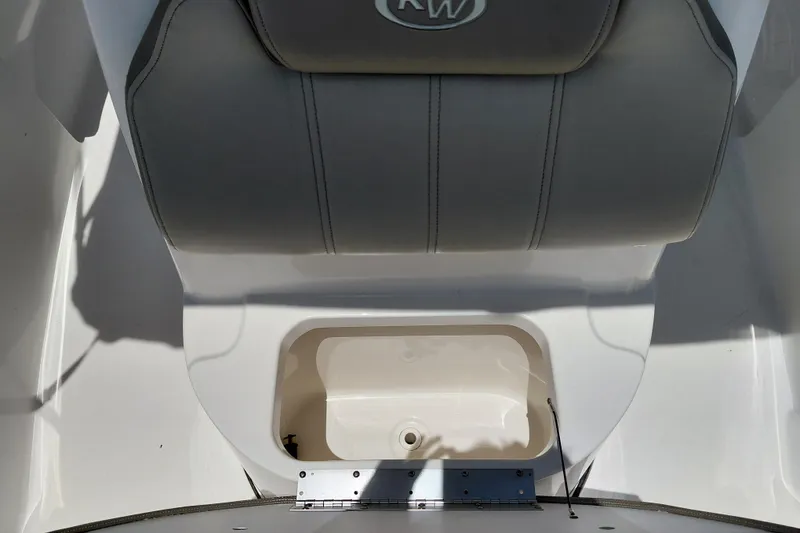 Slide: The Image of 2023 Key West 189 FS boat seat with storage compartment, featuring gray upholstery. - 18