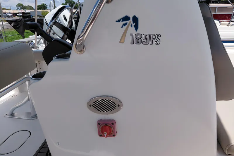 Slide: The Image of 2023 Key West 189 FS boat interior with steering wheel and console details. - 19