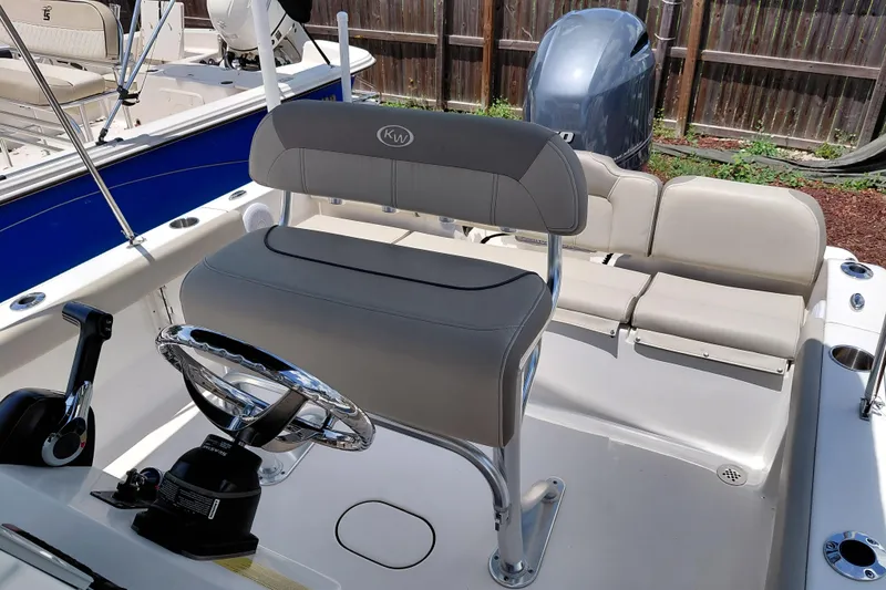 Slide: The Image of 2023 Key West 189 FS boat interior with steering wheel and seating. - 21