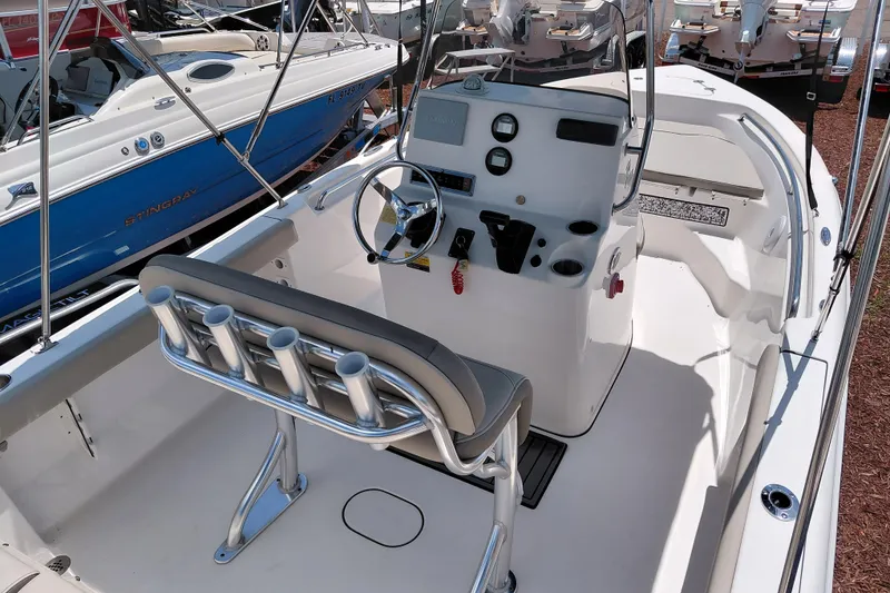 Slide: The Image of 2023 Key West 189 FS boat interior with steering console and seating. - 29