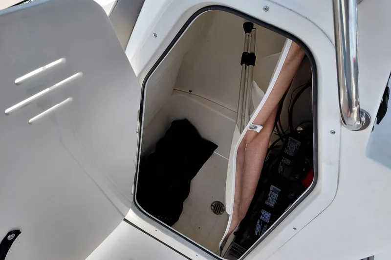 Slide: The Image of Open storage compartment on 2023 Key West 189 FS boat, showing interior details. - 31