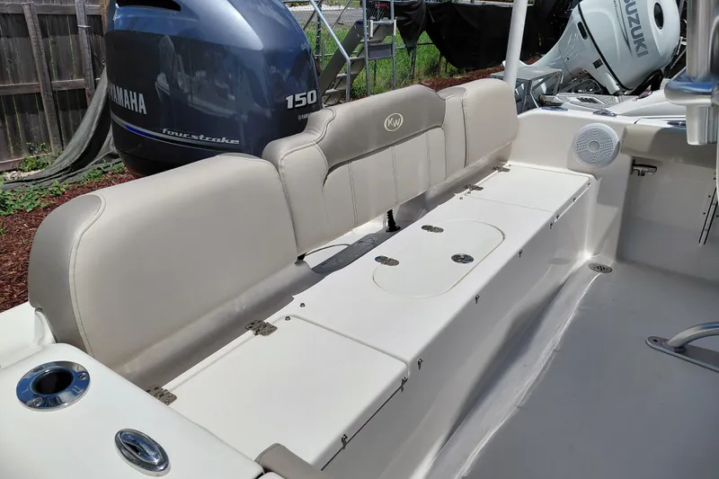 Slide: The Image of 2023 Key West 189 FS boat interior with Yamaha 150 engine, featuring seating and storage. - 32