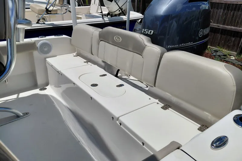 Slide: The Image of 2023 Key West 189 FS boat interior with Yamaha engine, featuring comfortable seating. - 33