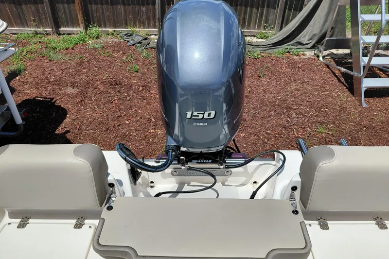 Slide: The Image of 2023 Key West 189 FS boat with Yamaha 150 outboard motor in backyard setting. - 37