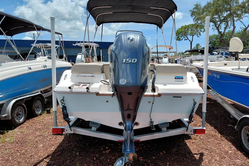 Slide: The Image of 2023 Key West 189 FS boat with Yamaha 150 engine, parked on a trailer. - 5