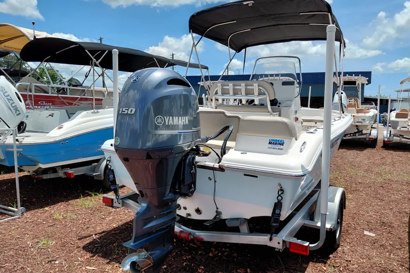 Slide: The Image of 2023 Key West 189 FS boat with Yamaha 150 engine, displayed outdoors. - 6