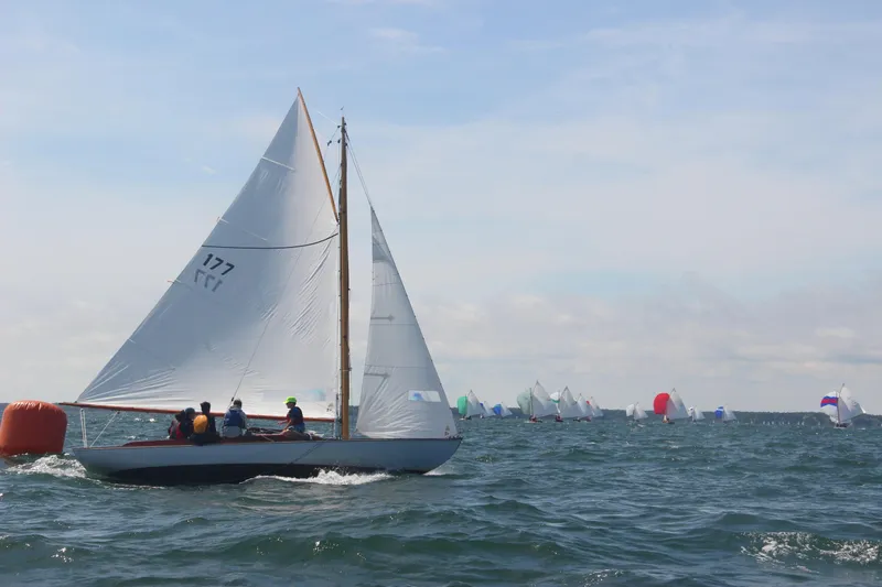 Slide: The Image of Sailboat Crosby Wianno Senior 1998 racing on open water with other boats in the background. - 4