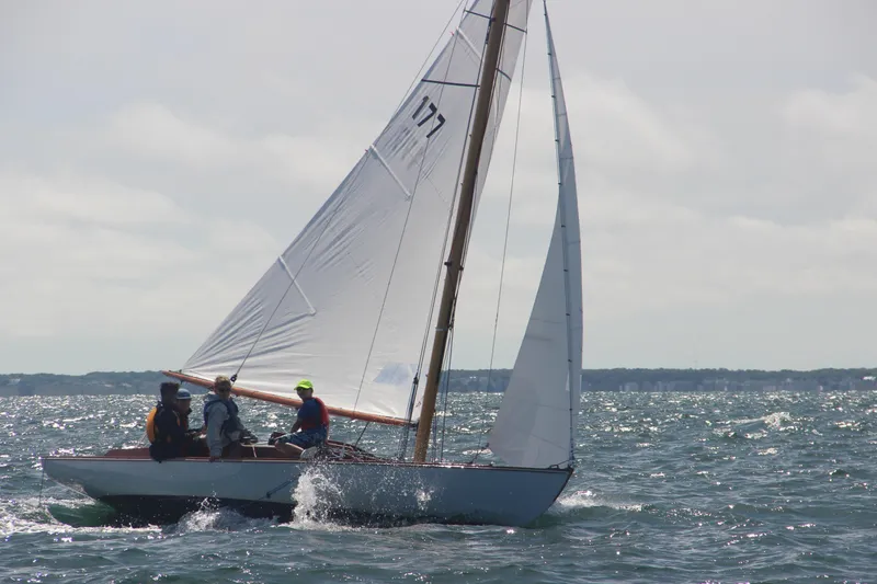 Slide: The Image of Sailboat Crosby Wianno Senior 1998 on open water with crew sailing. - 5