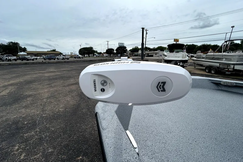 Slide: The Image of 2026 Xpress H20B Bay boat with Minn Kota Terrova trolling motor in a parking lot. - 14