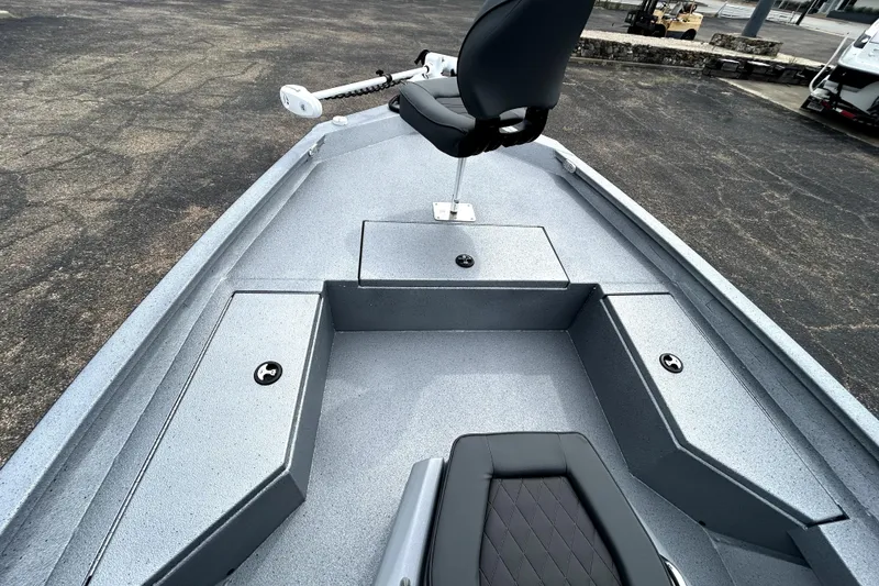 Slide: The Image of 2026 Xpress H20B Bay boat interior with seating and storage compartments. - 16