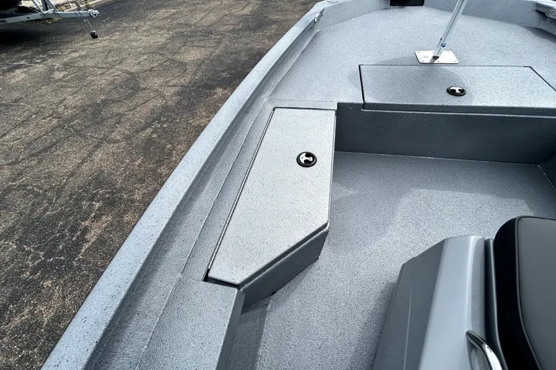 Slide: The Image of 2026 Xpress H20B Bay boat interior with storage compartments and seating. - 17