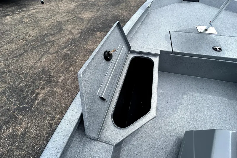 Slide: The Image of Open storage compartment on 2026 Xpress H20B Bay boat deck. - 18