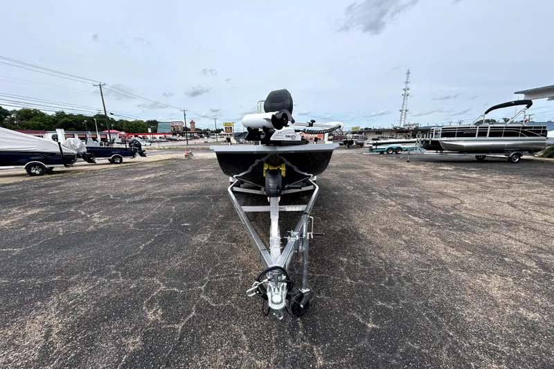 Slide: The Image of 2026 Xpress H20B Bay boat on trailer in parking lot. - 2