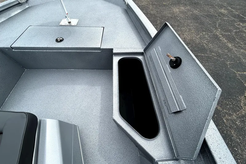 Slide: The Image of 2026 Xpress H20B Bay boat interior storage compartment with open hatch. - 22