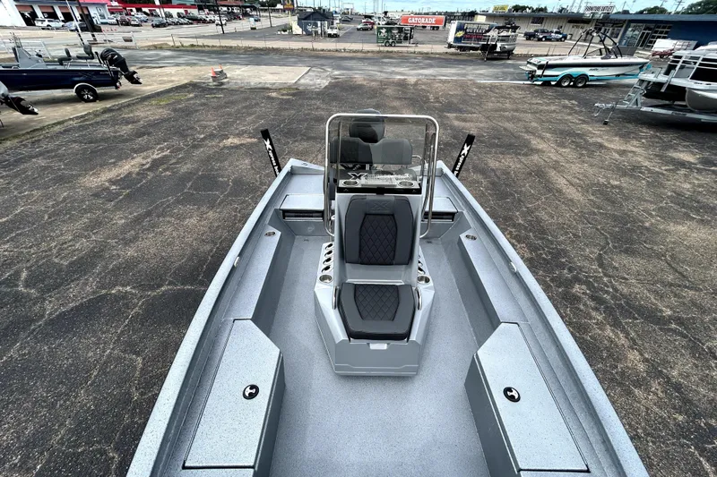 Slide: The Image of 2026 Xpress H20B Bay boat interior with seating and storage compartments. - 27