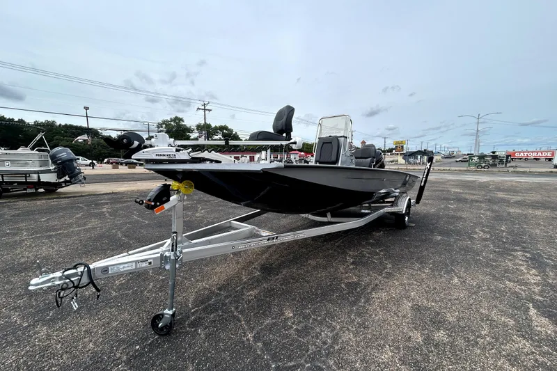 Slide: The Image of 2026 Xpress H20B Bay boat on trailer in outdoor dealership lot. - 3